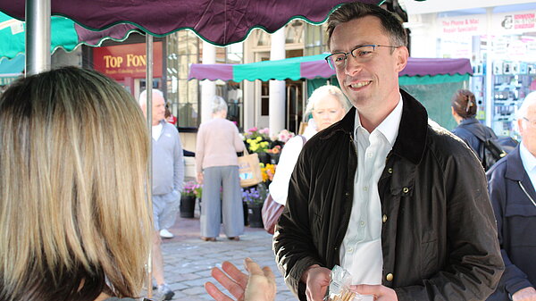 Ben talking to voter