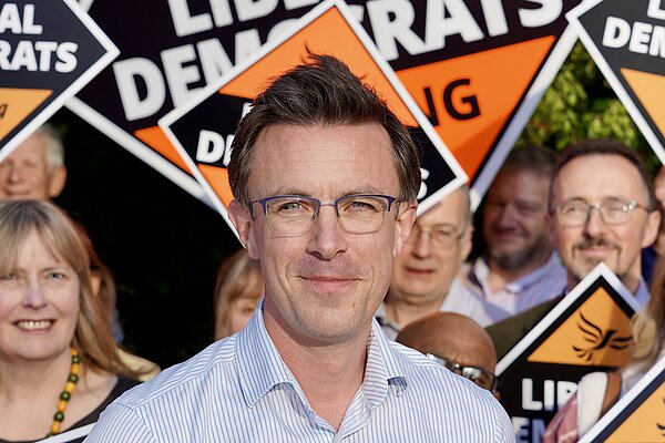 Candidate with supporters in background